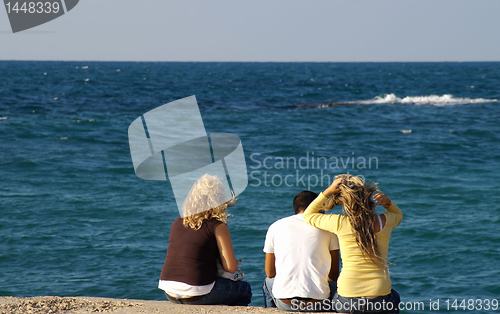 Image of Happy friends on a sea shore