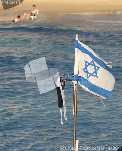 Image of Israel state flag on a beach