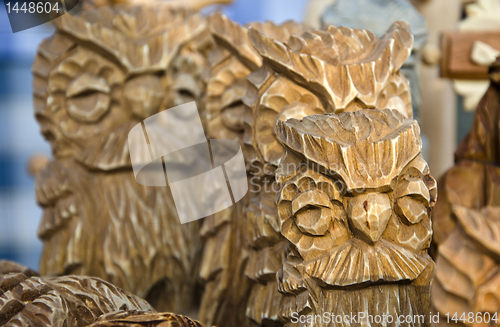 Image of Owl figurines carved of wood. Handmade wares.