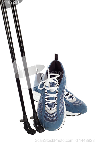 Image of sticks for Nordic walking and  sports shoes  isolated on white