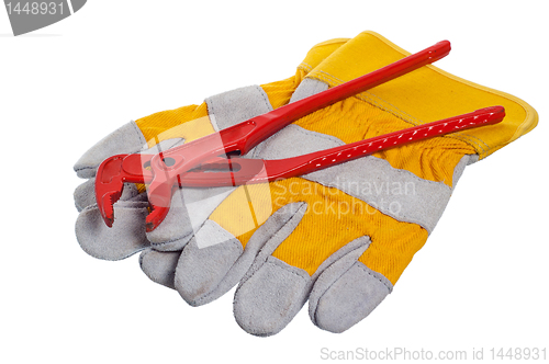 Image of Working gloves and wrenches isolated on white 