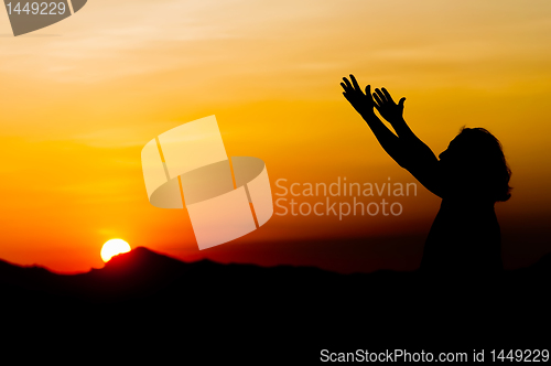 Image of Woman in Sunset