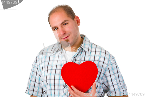 Image of Young man holding red heart