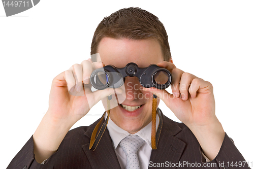 Image of Young businessman with binoculars
