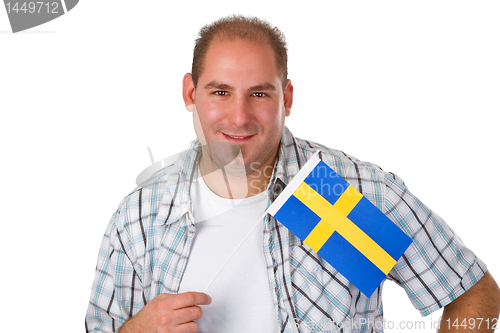 Image of Young man holding swedish flag