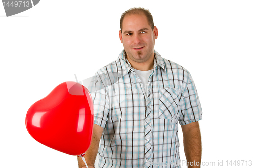 Image of Young man holding red heart