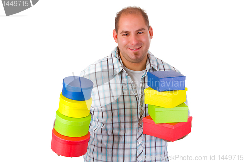 Image of Young man with colorful gift boxes