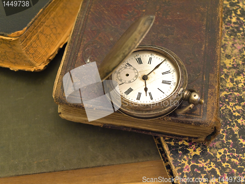 Image of books and clock 