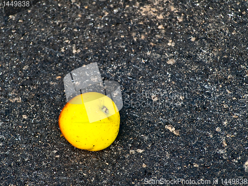 Image of apple at asphalt