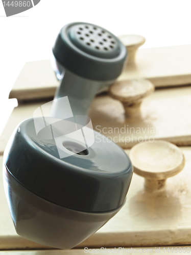 Image of telephone handset hang over the drawers