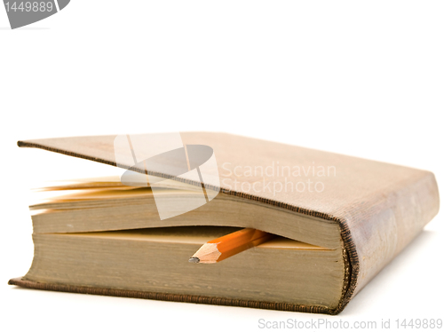 Image of book and pencil