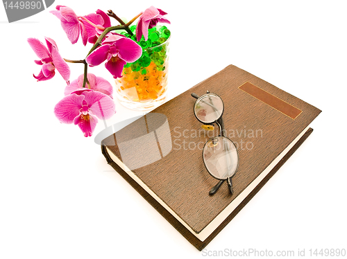 Image of book and  glasses