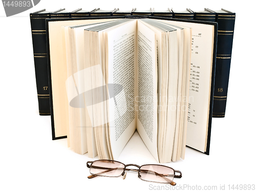 Image of open book and glasses