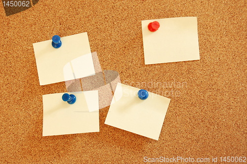 Image of blank sheet of paper on bulletin board