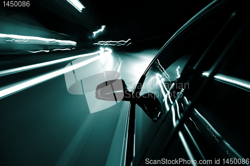Image of night drive with car in motion 