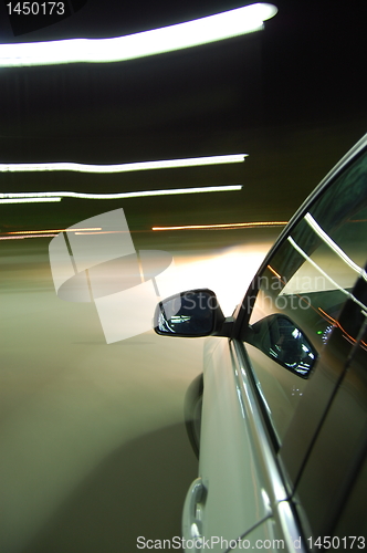 Image of night drive with car in motion 