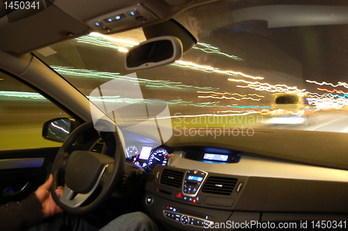 Image of car in motion at night