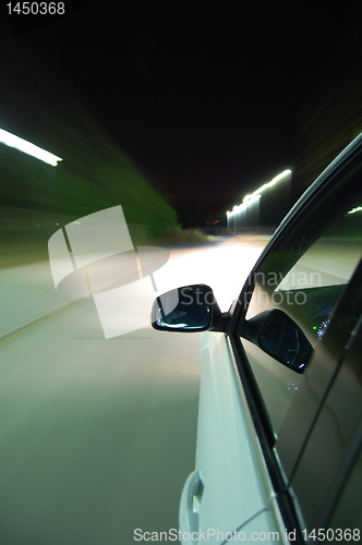 Image of night drive with car in motion 