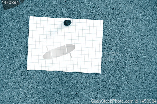 Image of blank sheet of paper on bulletin board