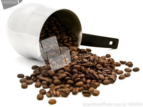 Image of Turkish percolator with scattered coffee beans