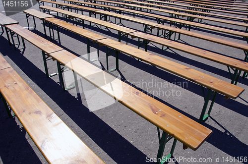 Image of Wooden benches placed in square for meeting.