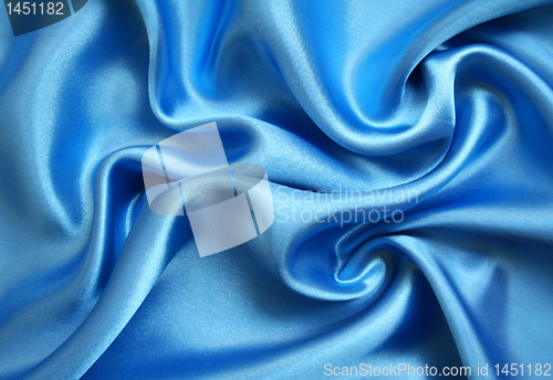 Image of Smooth elegant blue silk as background 
