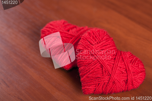 Image of two red thread hearts 