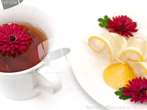 Image of tea, lemon and flowers