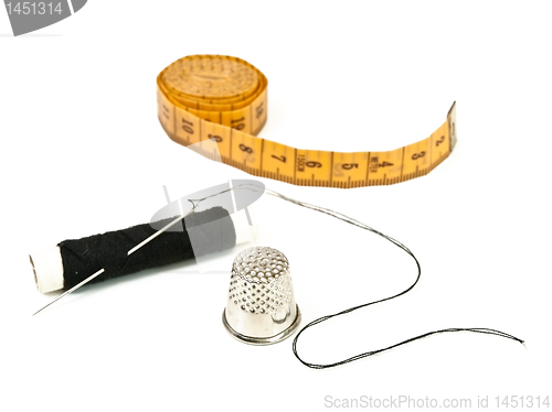 Image of needle, centimeter, thread and  thimble