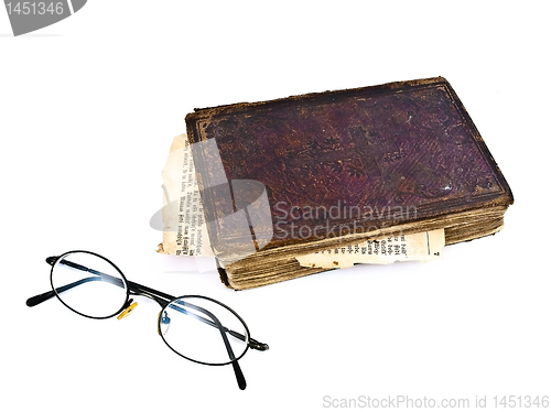 Image of old book and glasses
