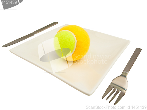 Image of  knife,  fork and tennis-ball at plate