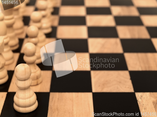 Image of pawns at chess-board