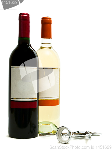 Image of red and white wine bottles with corkscrew