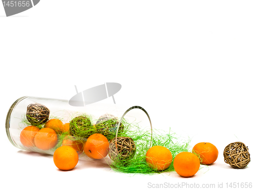 Image of decorative glass vase with mandarines