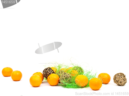 Image of mandarines and golden balls with green