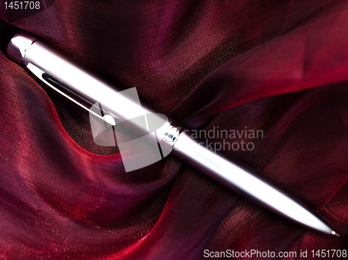 Image of silver pen at fabric