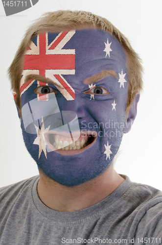 Image of Face of crazy angry man painted in colors of australia flag