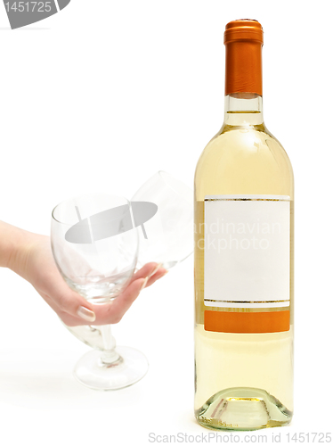 Image of white wine with wineglass in hand