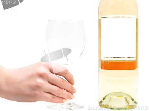 Image of white wine with wineglass in hand