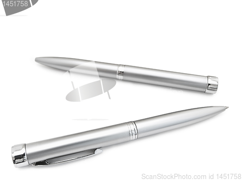 Image of ballpoint pens in the box over the white background