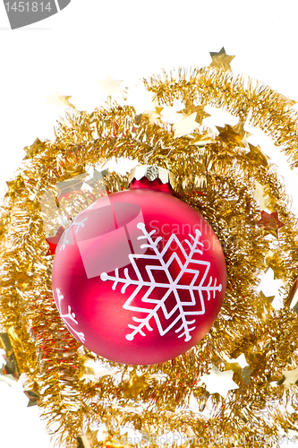 Image of christmas ball with snowflake symbols and tinsel