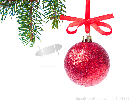 Image of red christmas ball hanging from tree