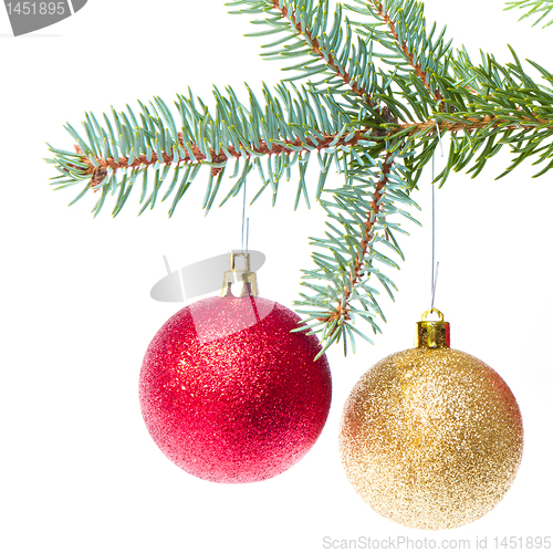 Image of red christmas ball hanging from tree