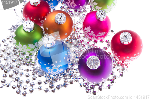 Image of christmas balls with snowflake symbols