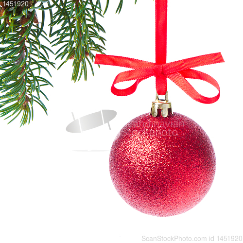 Image of red christmas ball hanging from tree