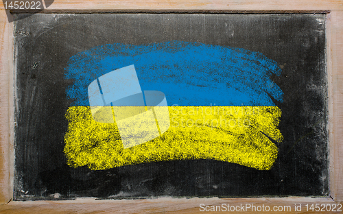 Image of flag of ukraine on blackboard painted with chalk  