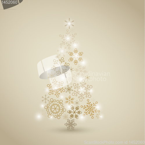 Image of Christmas tree made from golden snowflakes