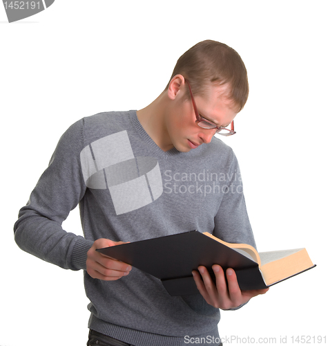 Image of a young man reading a great book