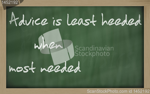 Image of " Advice is least heeded when most needed " written on a blackbo