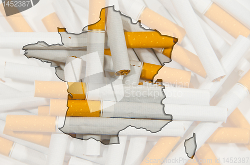Image of Map of Finland with cigarettes in background